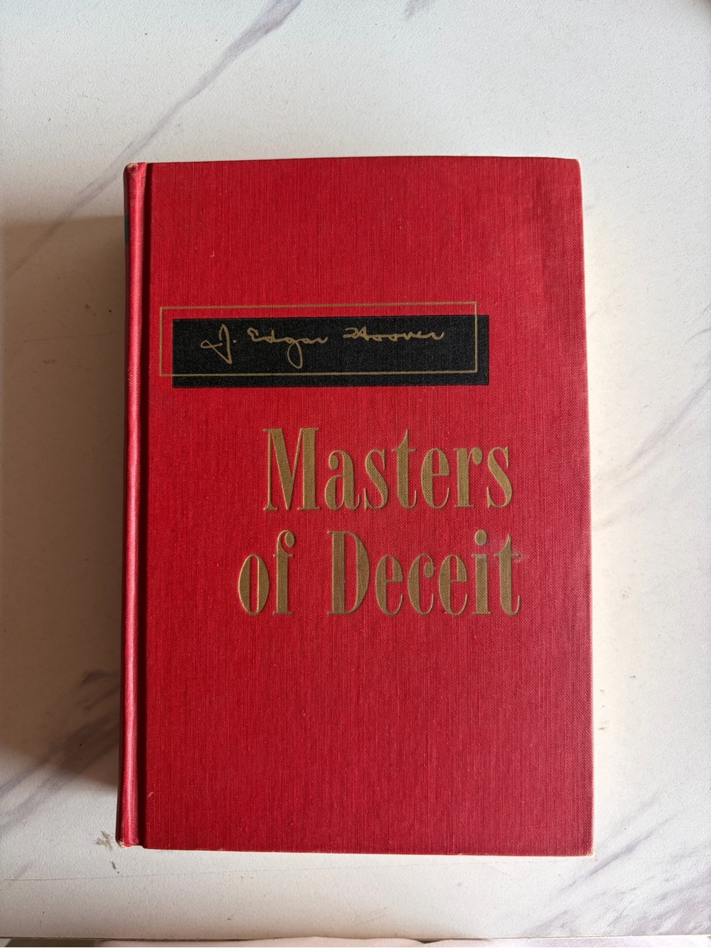 Red Hardcover 'Masters of Deceit' Decorative Book by